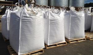 Bulk FIBC tote bags filled with product and stacked on pallets